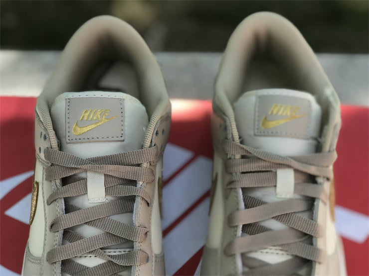 Dunk Low Gold Swoosh